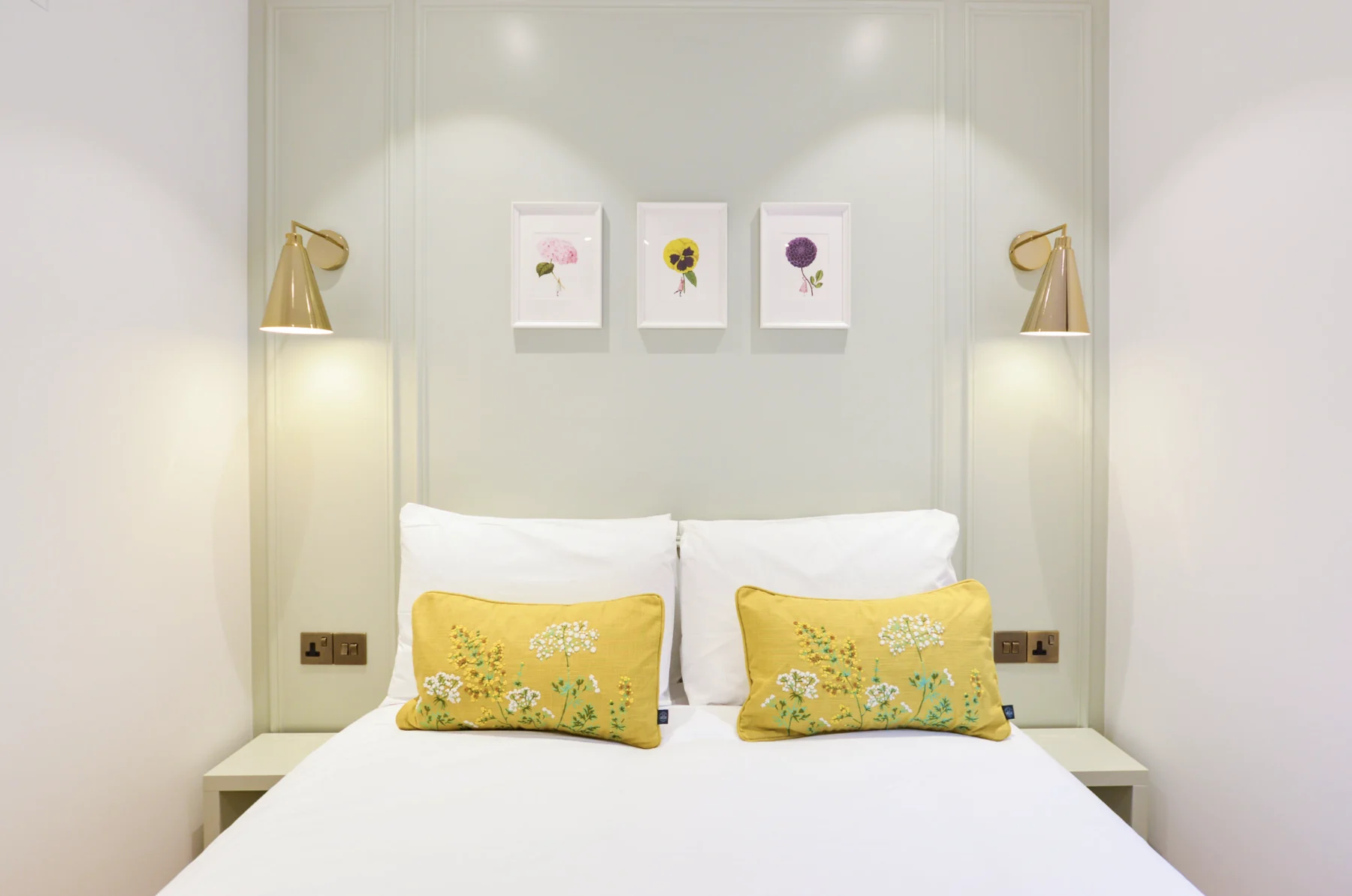 Maida Vale bedroom with yellow accents and pale panelling